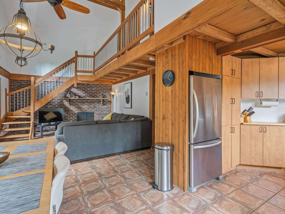 Open living space with staircase and cozy seating