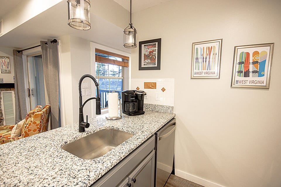 The kitchen has a drip-style/Keurig coffee maker.