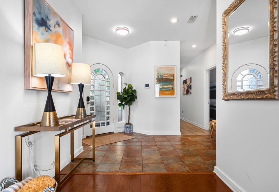Bright entry hall with stylish décor and warm lighting.