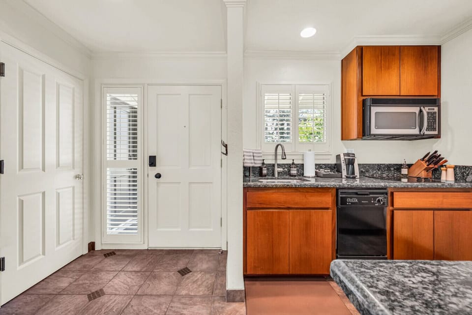 This bright and fully equipped kitchen is ready for morning coffee, afternoon snacks, or a cozy night in
