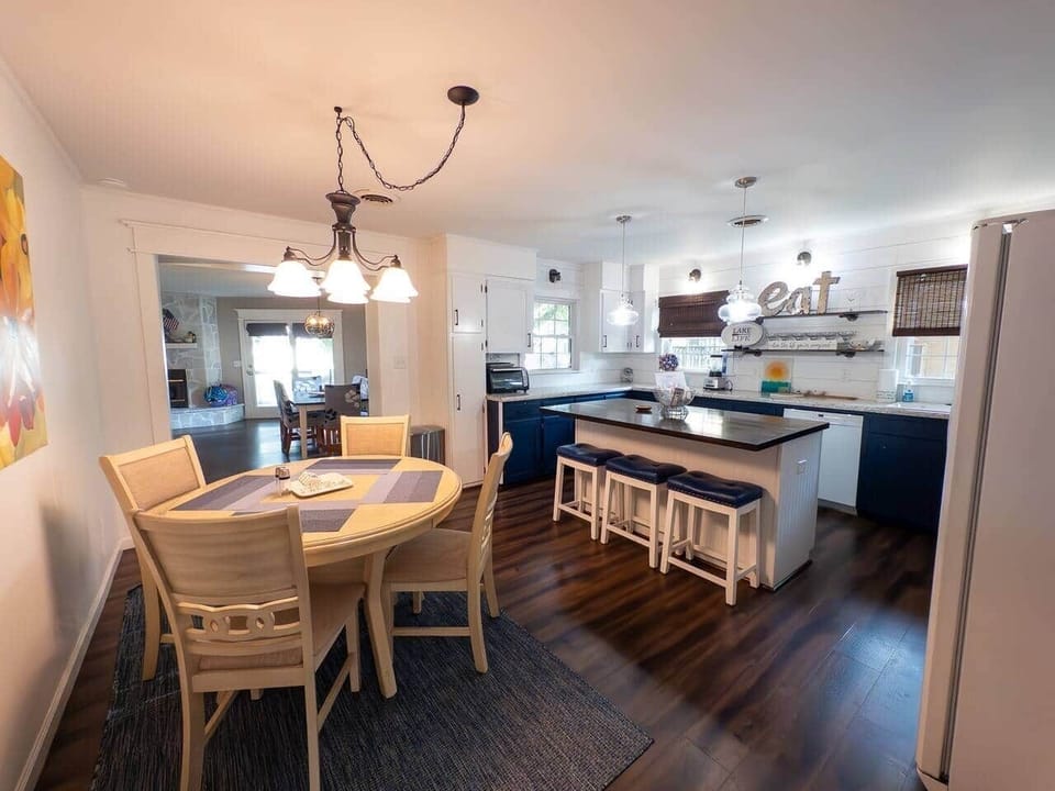 Alternate view of the eat-in kitchen, the round table and 3 stools add to the large dining room table to seat up to 13 people!
