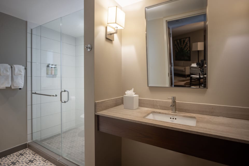 Designer toiletries, hair dryer, bathrobes, towels