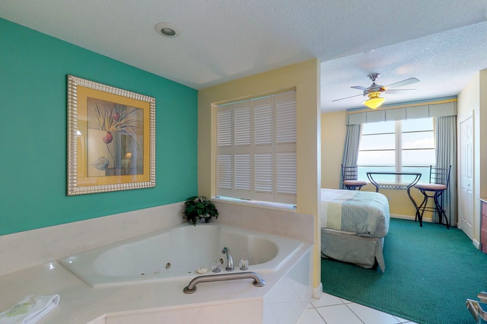 Unwind in this spa-style soaking tub just steps from the oceanview bedroom. A perfect beach stay retreat, ideal for relaxing after sun-filled days by the shore and coastal adventures.