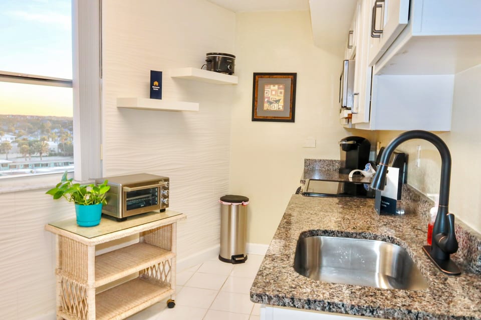 This well-appointed kitchen makes your beach stay easy and convenient, offering modern appliances, ample prep space, and natural light—perfect for quick meals before the beach or winding down after a day by the ocean.