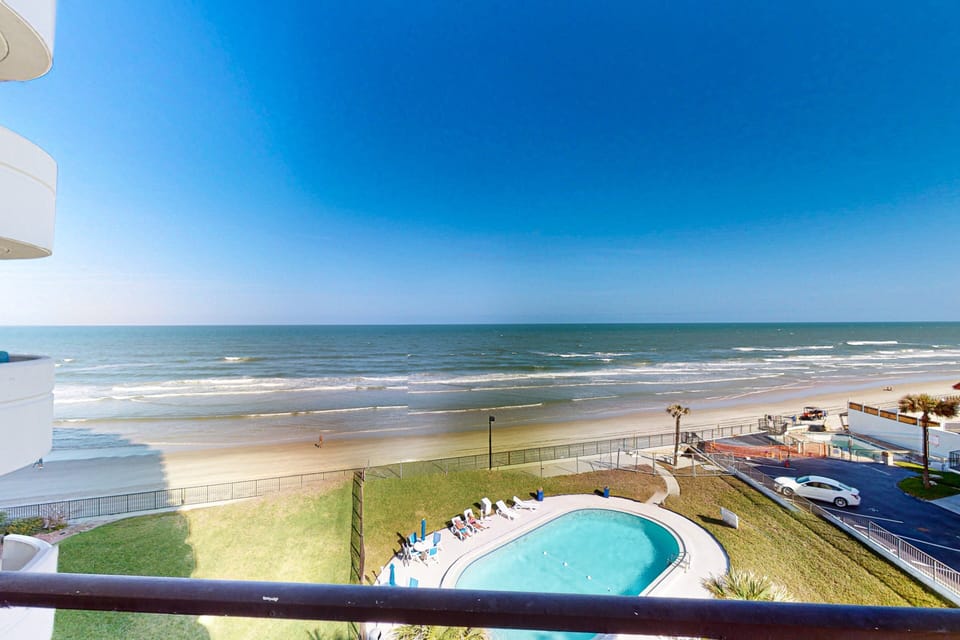 Enjoy your beach stay with unbeatable oceanfront views overlooking the shoreline and sparkling pool. Relax on the balcony and soak in the sights and sounds of the waves just steps from the sand.