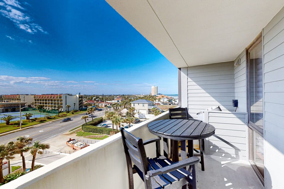 Enjoy a relaxing beach stay on this private balcony with seating and sweeping city-to-coast views. Perfect for sipping morning coffee or unwinding after a day on the sand and surf.