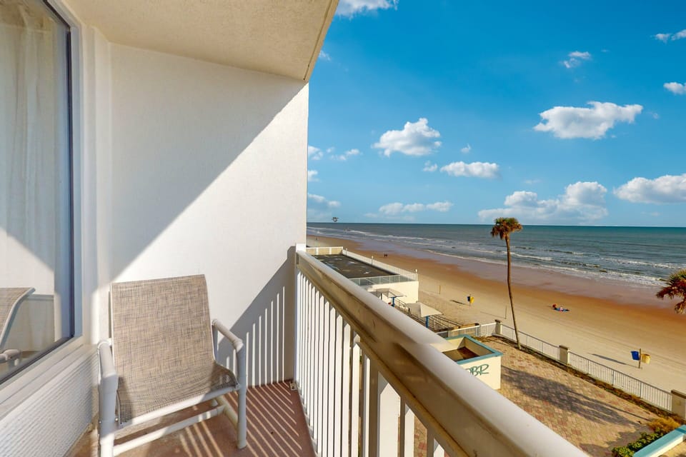 Relax on your private balcony and soak in stunning oceanfront scenery. Enjoy the gentle sea breeze and endless shoreline—perfect for unwinding during your beach stay.