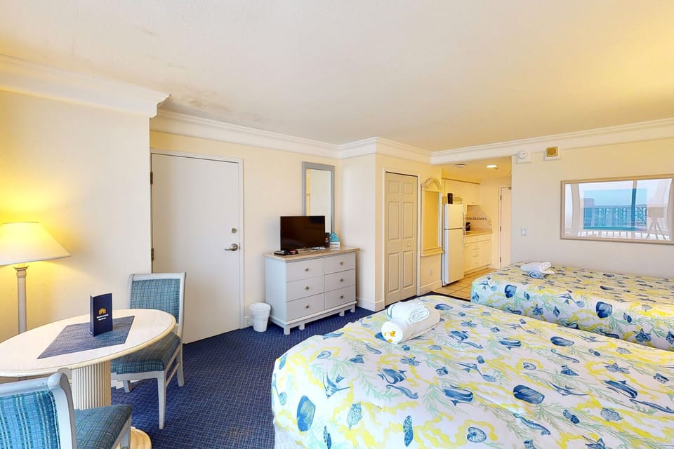 Relax in this sunny beach getaway featuring two comfy beds, a dining nook, and a flat-screen TV. Enjoy a spacious layout and easy access to the shore—perfect for a refreshing coastal stay.