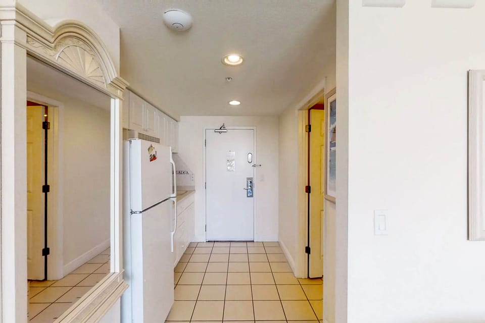 Spacious entry with a full kitchen, ample storage, and easy access to your beach stay oasis—perfect for quick meals before heading out to the shore.