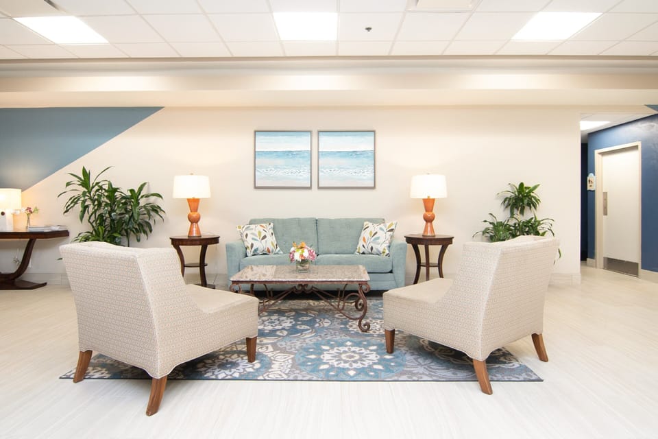 Relax in this welcoming lobby lounge, featuring coastal décor and comfy seating—perfect for unwinding before or after your beach stay.