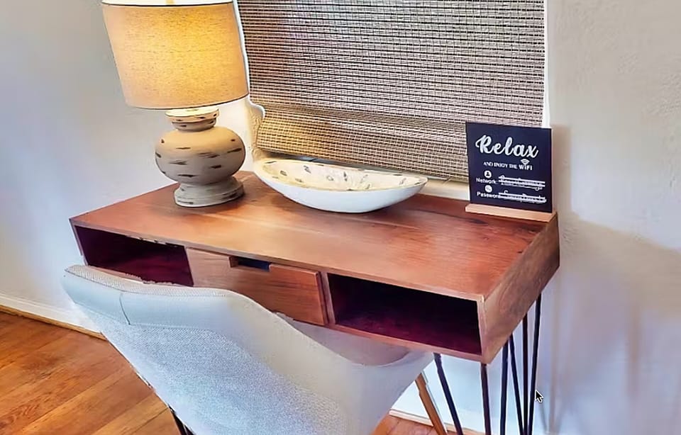 Charming desk nook with warm lighting and beach-inspired touches—perfect for remote work, journaling, or planning island adventures while enjoying a relaxed, comfortable beach stay.