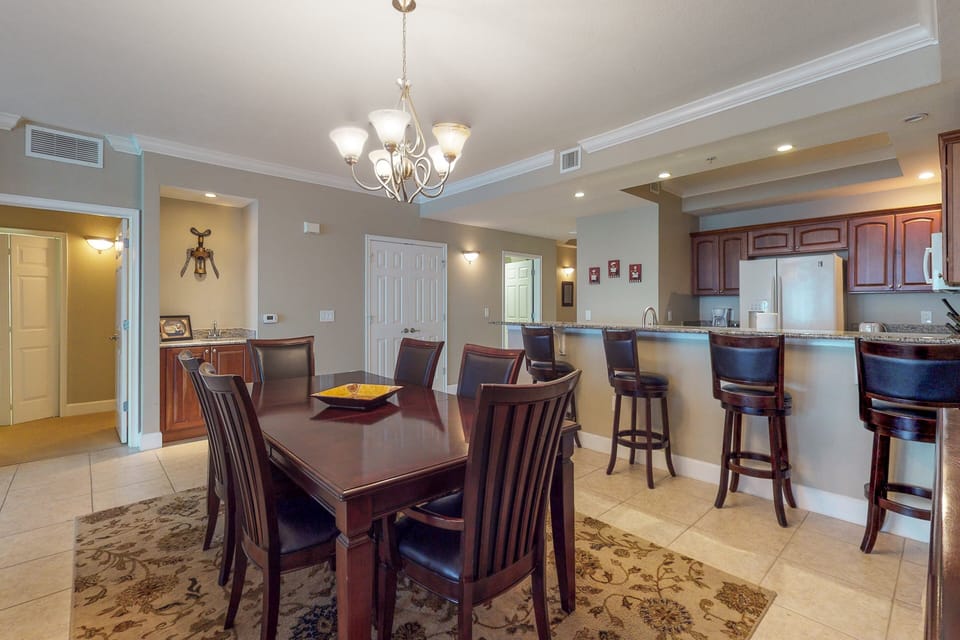 Gather in this spacious dining area with comfortable seating and bar-height counter, perfect for shared meals and planning beach days. An ideal space to connect, dine, and enjoy your relaxing beach stay.