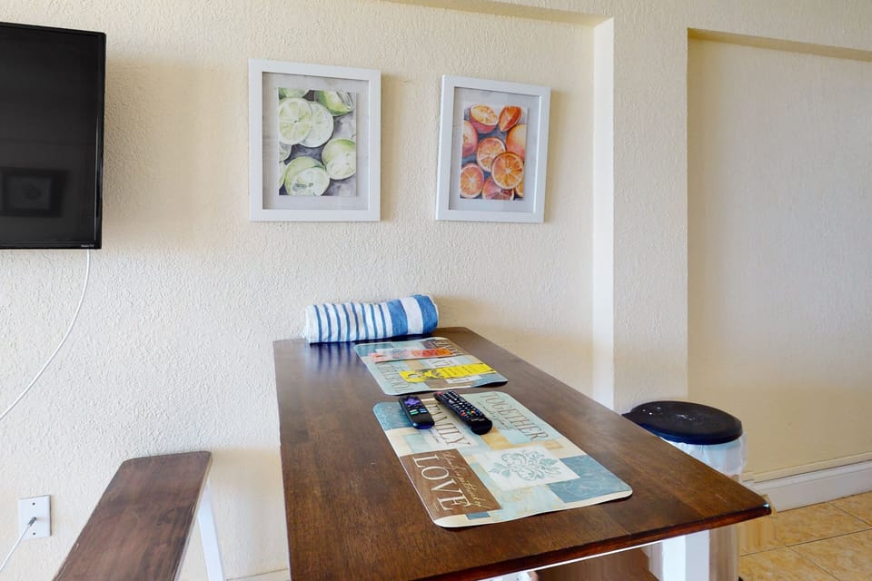 Enjoy casual meals and downtime in this cozy dining nook, perfect for your beach stay. A simple, inviting space to plan seaside adventures, relax with snacks, and unwind after days by the shore.