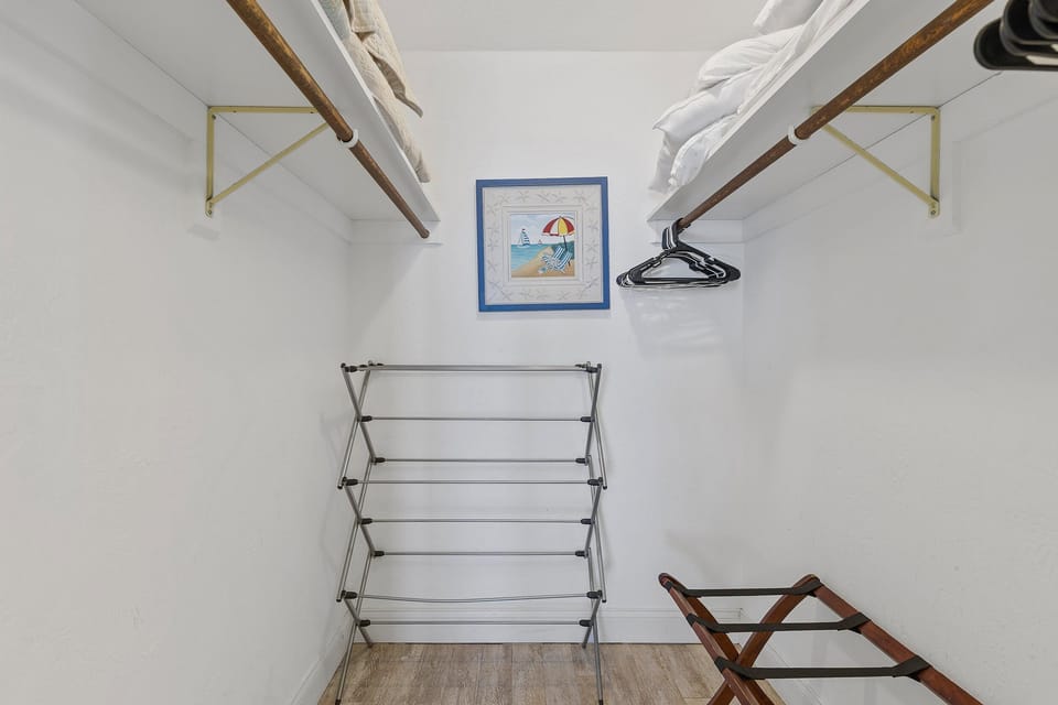 Settle in comfortably during your beach stay with this spacious walk-in closet. Offering ample storage for luggage and vacation essentials, it keeps your coastal getaway organized and stress-free.