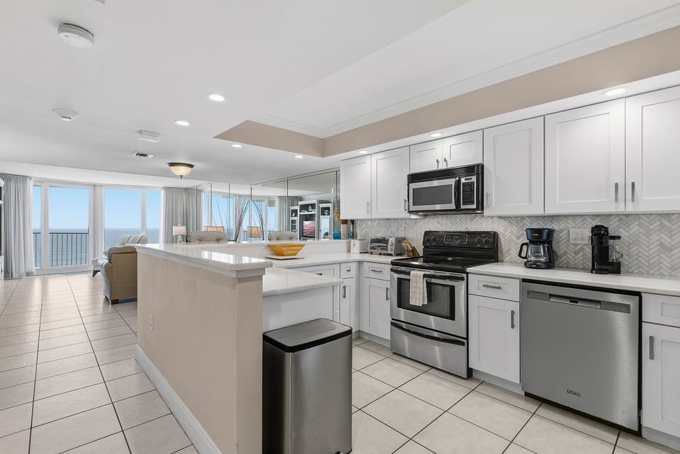 Enjoy a relaxing beach stay in this modern, fully equipped kitchen with ocean views. The open-concept layout flows into the living area, making it perfect for coastal meals, gatherings, and effortless beach vacation living.