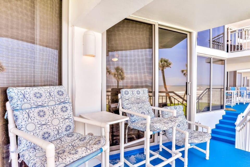 Relax on this inviting oceanfront balcony with breezy seating and soothing beach views. Perfect for morning coffee or sunset unwinding during your coastal stay.