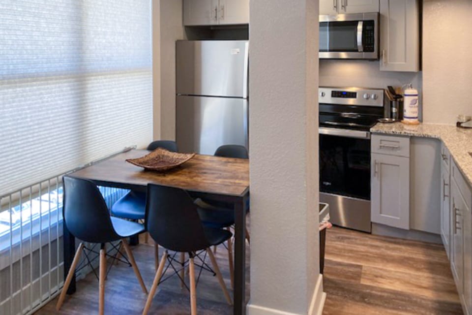 Bright, fully equipped kitchen with modern appliances and cozy dining space, ideal for meals during your beach stay. Enjoy the convenience of cooking, dining, and relaxing after a fun-filled day by the shore.