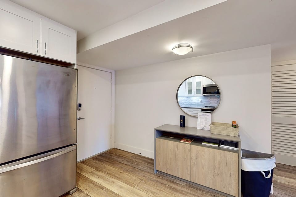 This clean, modern entryway offers convenient storage and easy access to the kitchen—perfect for unpacking after the beach. Thoughtfully designed to keep your beach stay organized and stress-free.