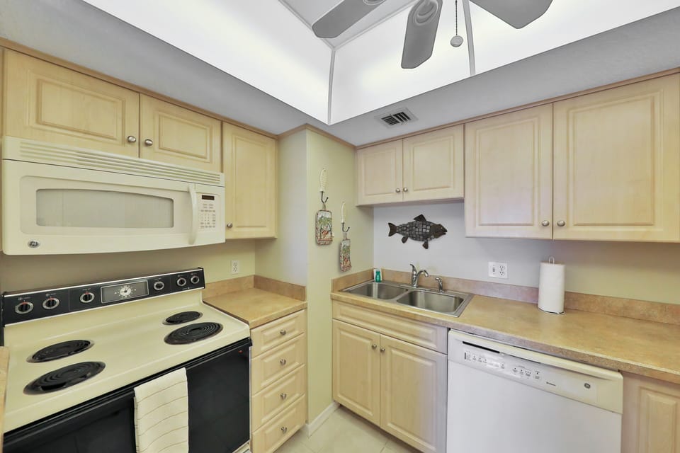 Clean, well-equipped kitchen with modern appliances and coastal accents. Ideal for cooking meals and beach-day snacks, making your beach stay comfortable, convenient, and stress-free.