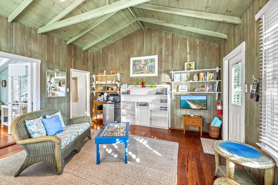 The open living area stretches comfortably from kitchenette to seating.