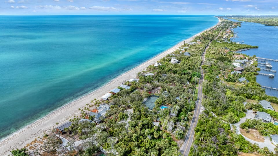 8.6 lush acres span Manasota Key from Lemon Bay to the Gulf.