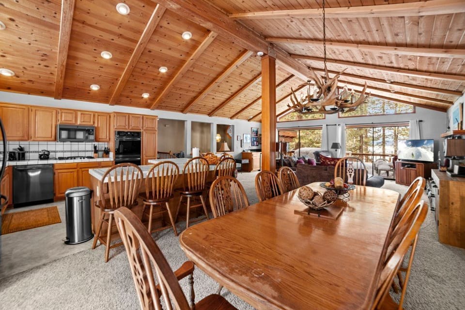 The fully-equipped kitchen and spacious dining area create an ideal setting for entertaining family and friends after a day of adventure.