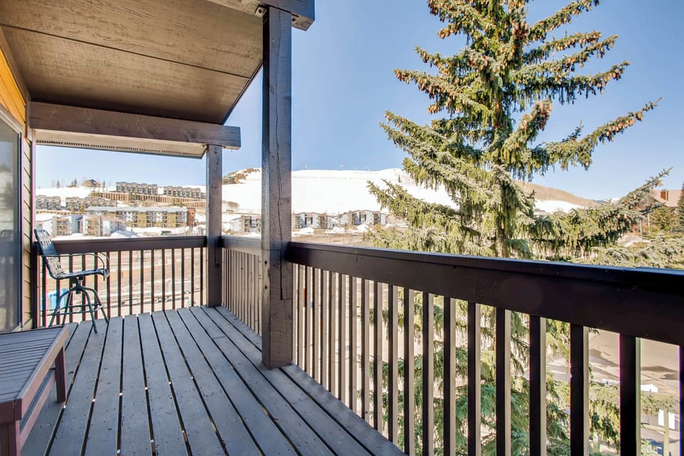 Step out onto the private balcony to soak in the stunning views of the surrounding mountains while enjoying fresh alpine air.