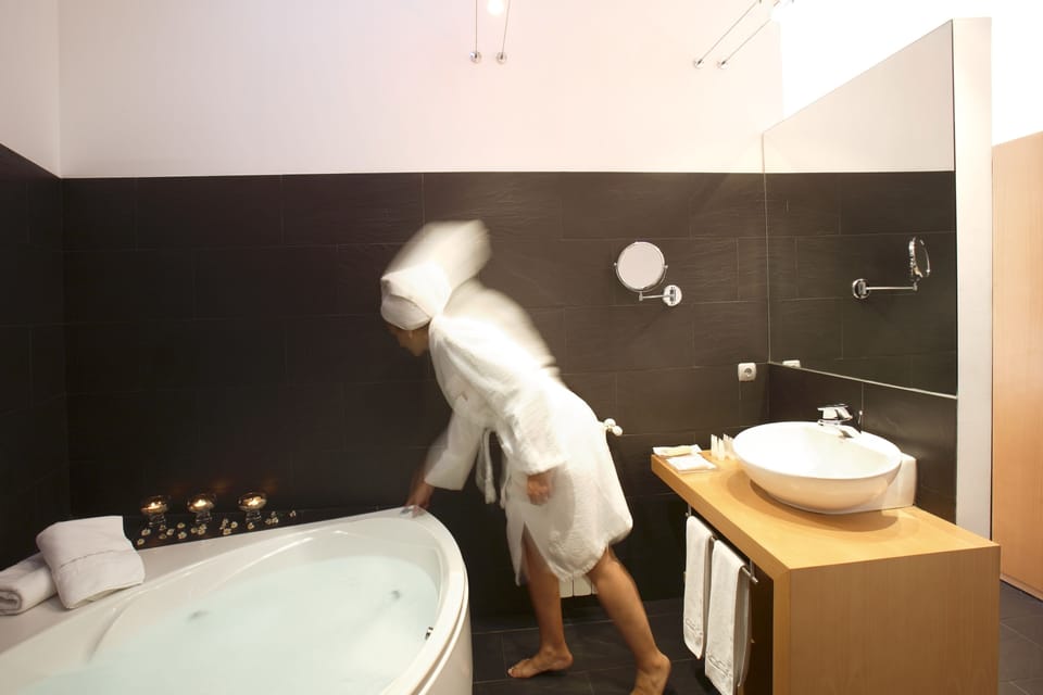 Superior Room, Jetted Tub | Bathroom | Free toiletries, hair dryer, towels, soap