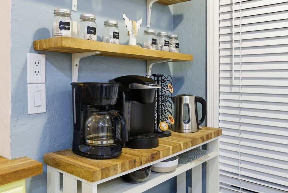 Fully stocked coffee and tea bar for your morning brew.