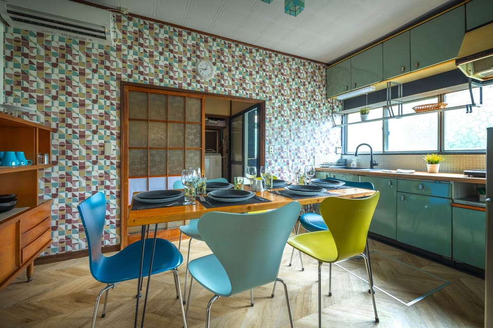 Enjoy family meals in a bright retro dining room with direct access to the kitchen.