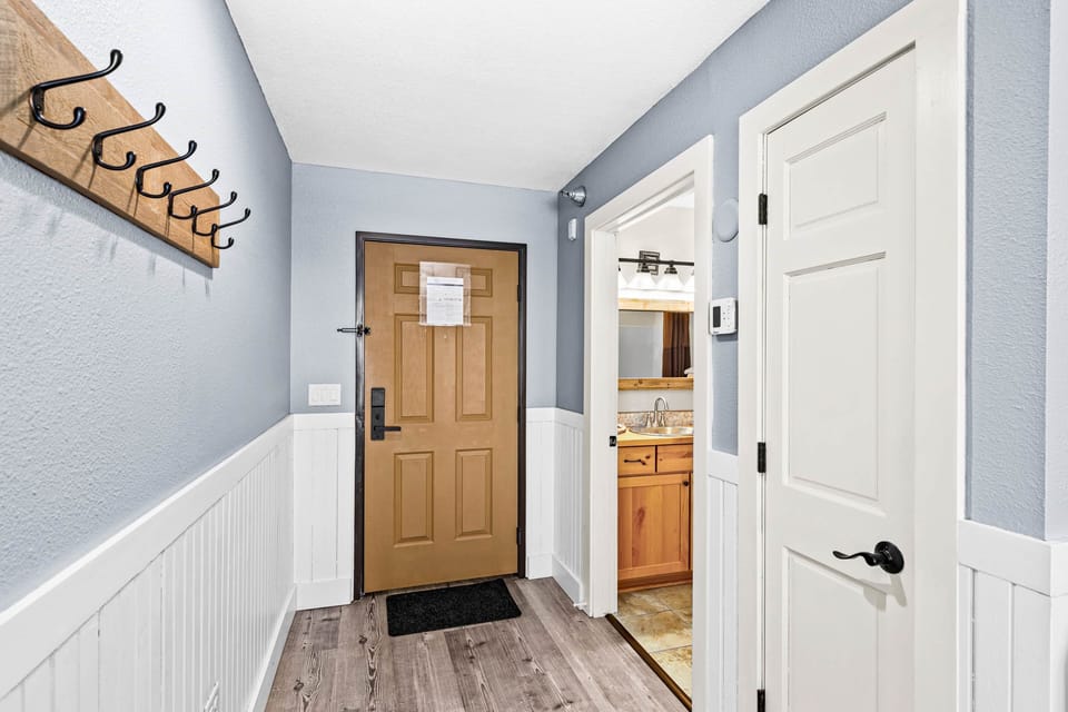 Elegant entrance doors leading to cozy, private bedroom