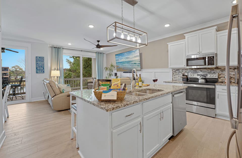 Seamlessly connected with kitchen and dining areas it is designed for socializing in style.