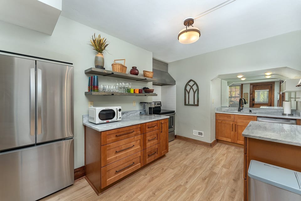Fully equipped kitchen with gas range, dishwasher, and Keurig coffee maker