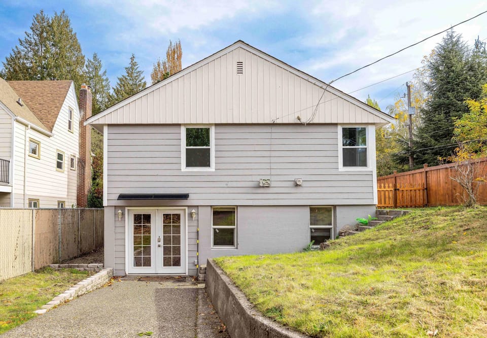 Private backyard entrance offering easy access and extra privacy for guests.