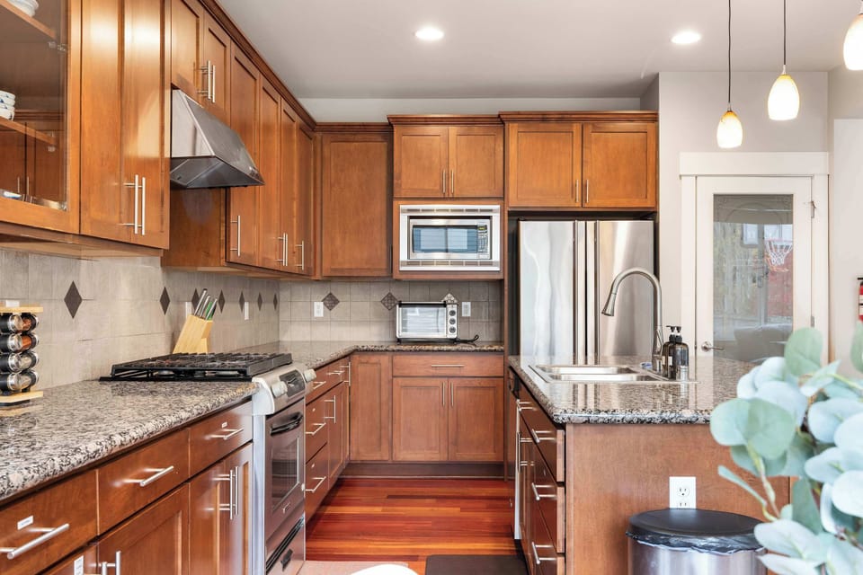 Chef-friendly layout with a gas stove, stainless steel appliances, and abundant cabinet storage.