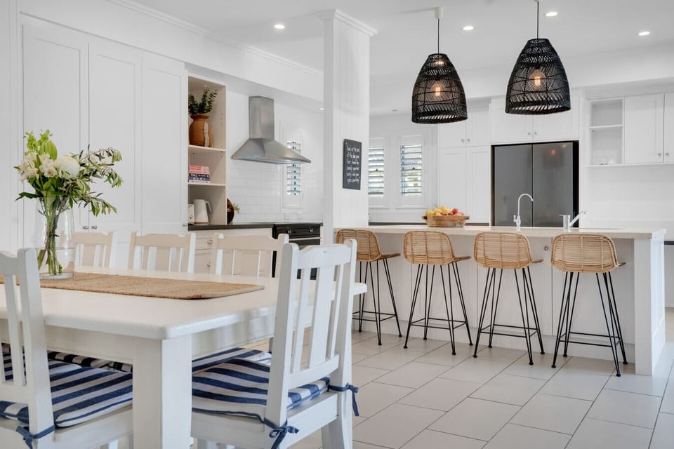 Open plan kitchen and dining area with breakfast bar