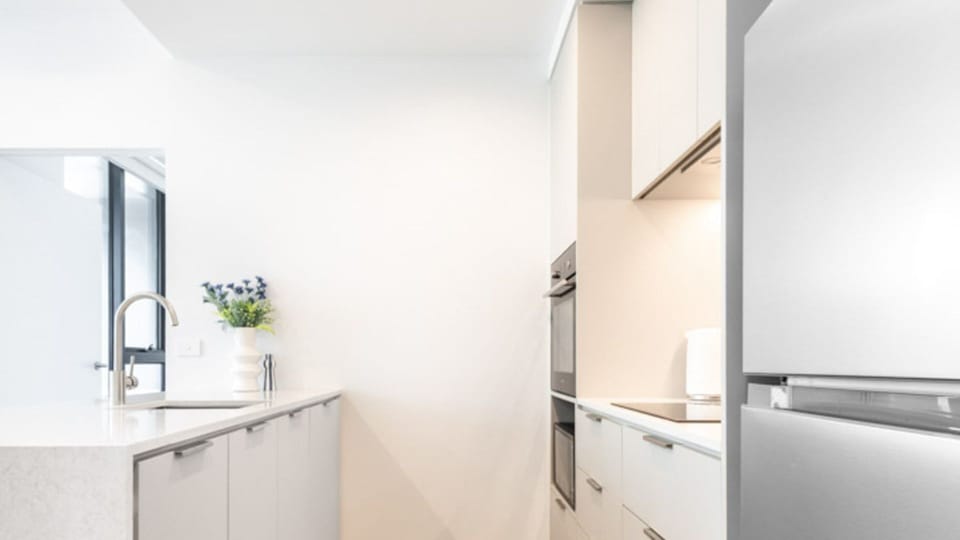 Modern kitchen with clean lines and ample storage space.