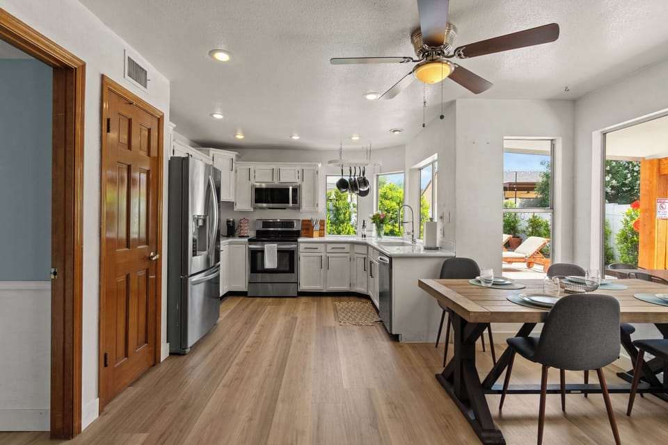 Bright kitchen with breakfast nook and everything needed for home cooking.