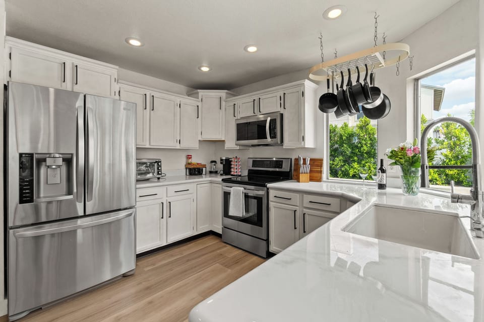 Fully stocked gourmet kitchen with modern appliances.