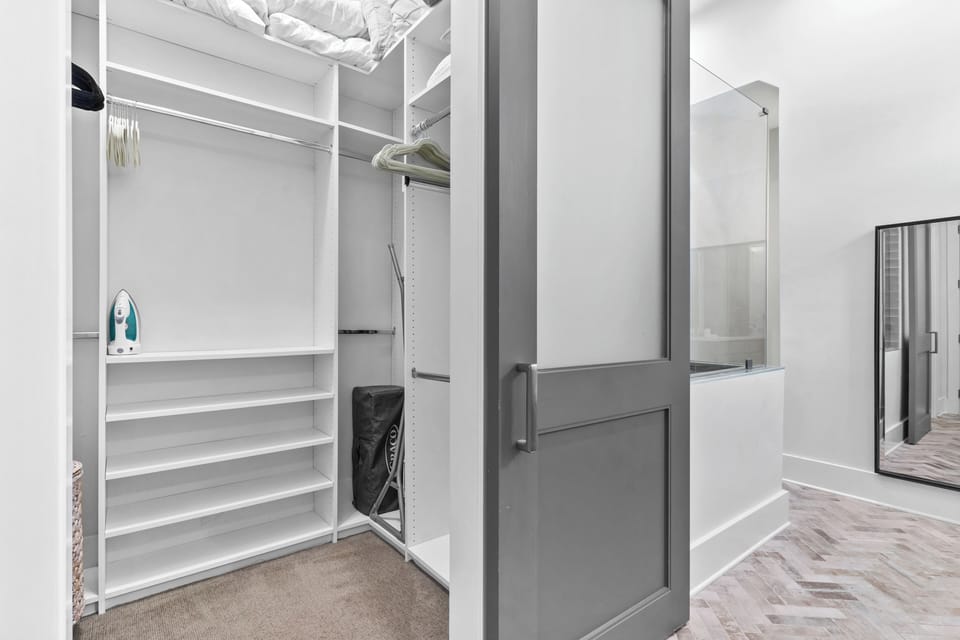 Ensuite bathroom 1 with a walk-in closet.