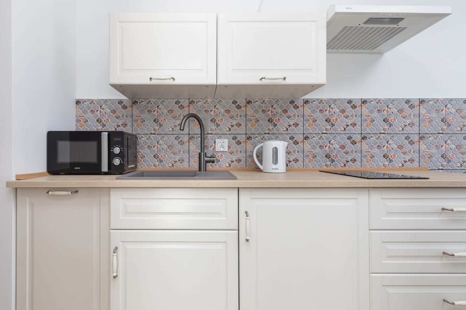 The fully equipped kitchenette includes everything you need for a home-cooked meal.