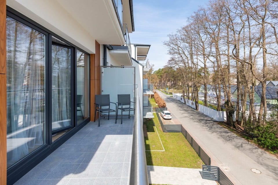 The balcony provides a perfect spot for enjoying the fresh air. 