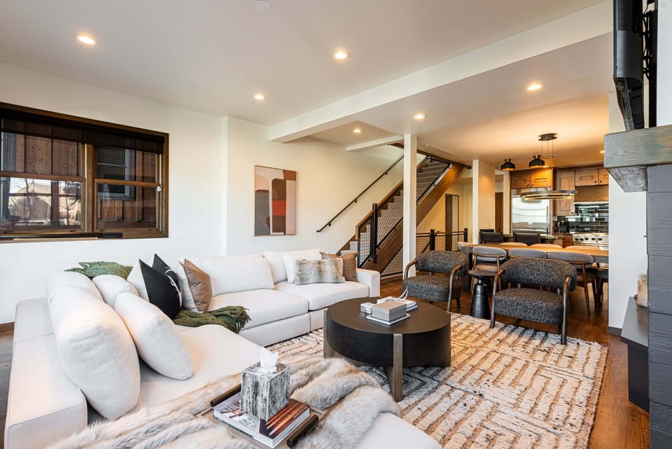 Living Room with cozy fireplace and ample seating for après-ski relaxation.