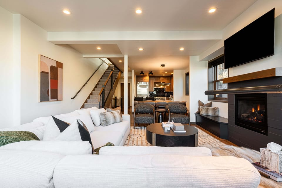 Living Room with cozy fireplace and ample seating for après-ski relaxation.