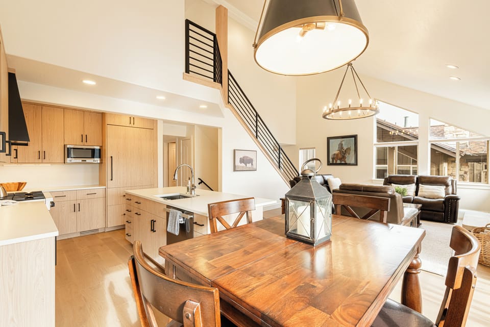 Modern kitchen and dining area with plenty of natural light.same