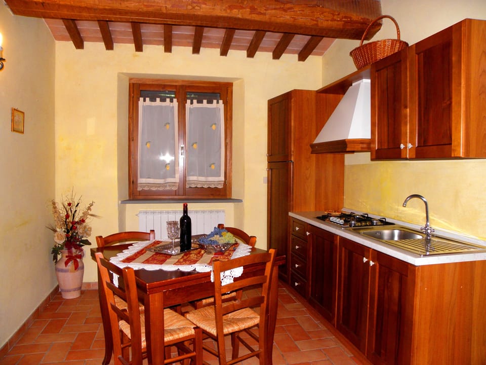 Full-size fridge, stovetop, coffee/tea maker, cookware/dishes/utensils