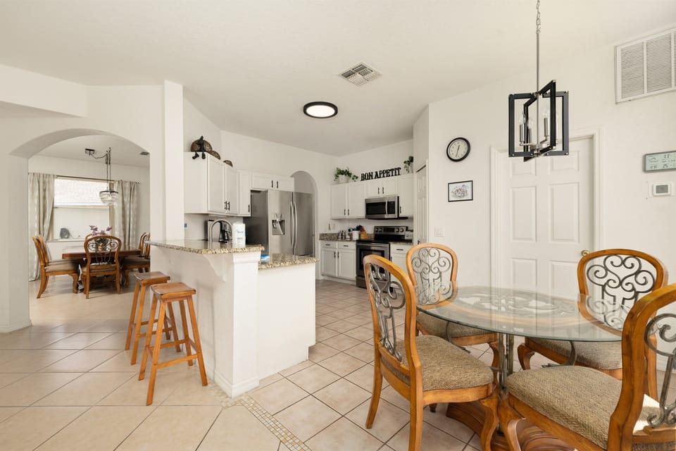 The breakfast nook has seating for four and there are two more seats at the counter.