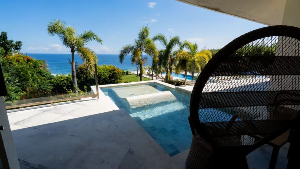Room, 1 King Bed, Sea View | Living area | Flat-screen TV