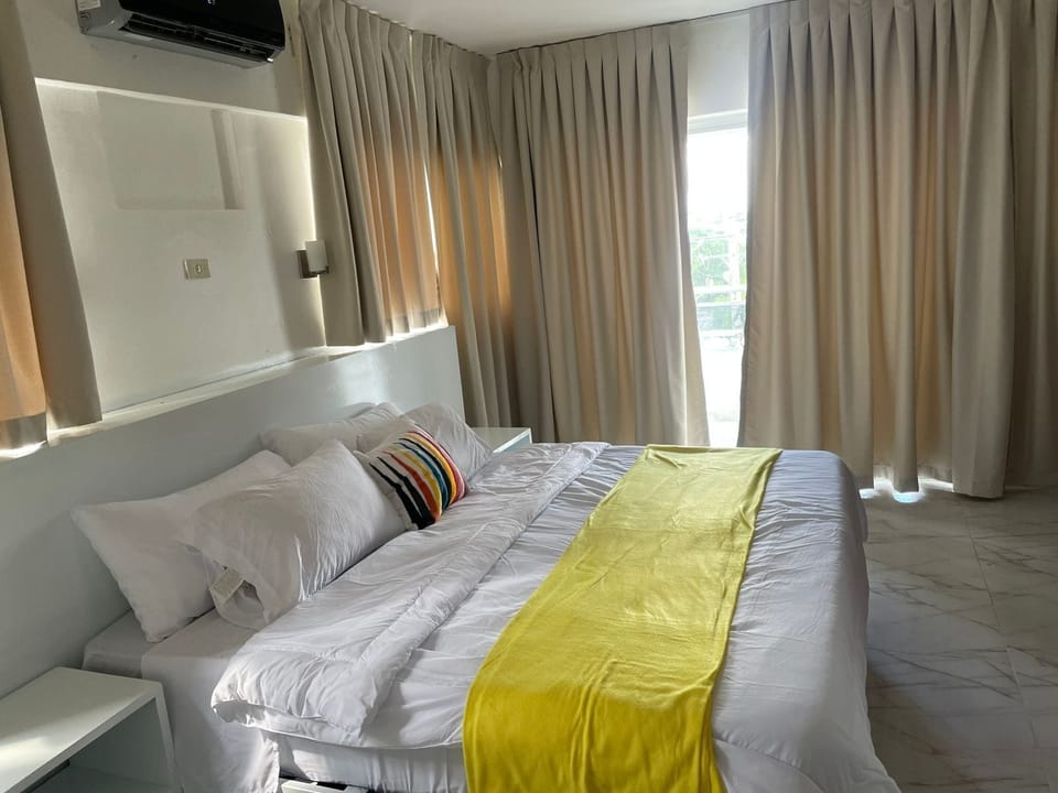 Superior Suite, 1 King Bed, City View | In-room safe, individually furnished, blackout drapes, soundproofing