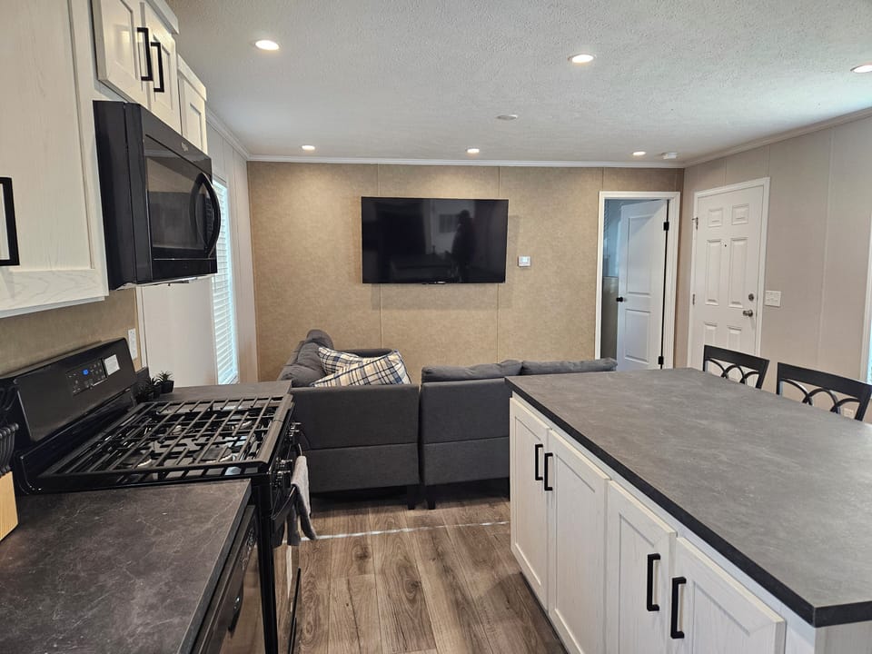Open kitchen with plenty of seating for the family to gather. 
